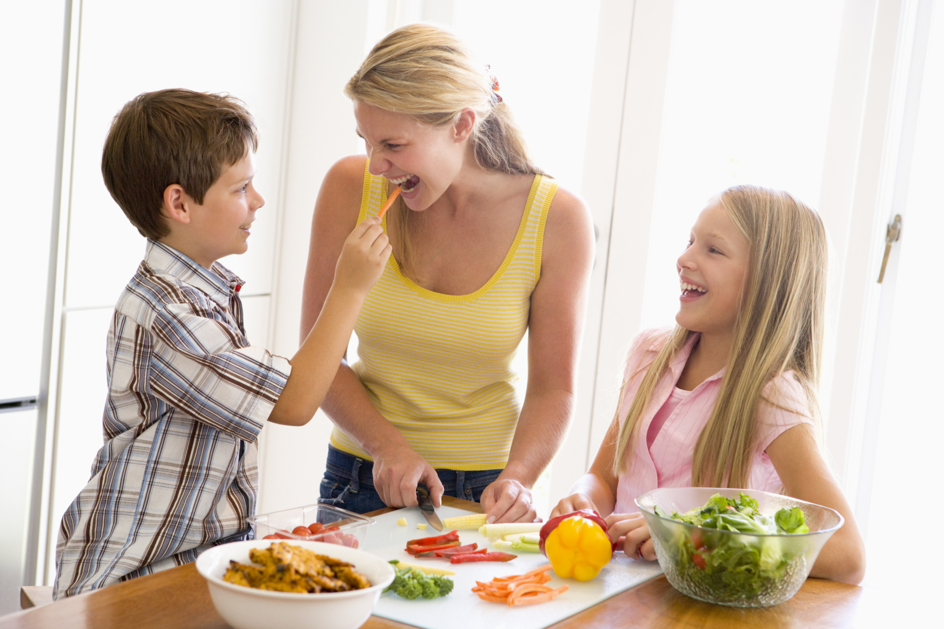 Mother And Children Prepare A meal,mealtime Together